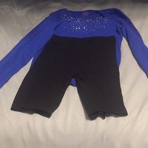 A blue shirt with diamond studs and biker shorts